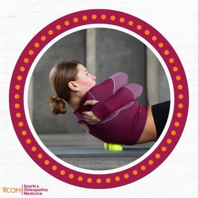 Woman rolling her back to release tension